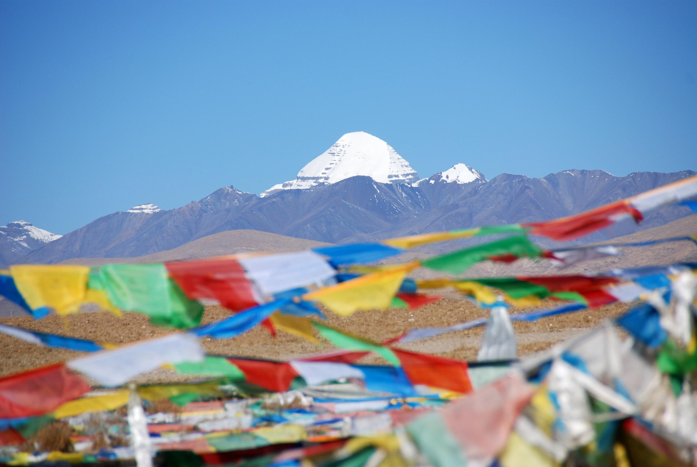 02 First View Of Mount Kailash With Prayer Flags The first view of Mount Kailash occurs after cresting a small hill.